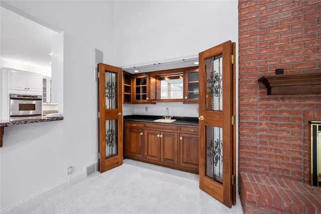 a spacious bathroom with a granite countertop sink and a mirror