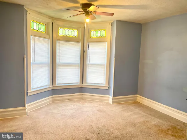 a view of an empty room and window