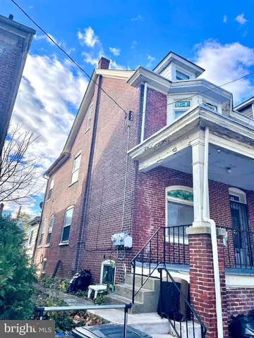 a front view of a building with glass windows