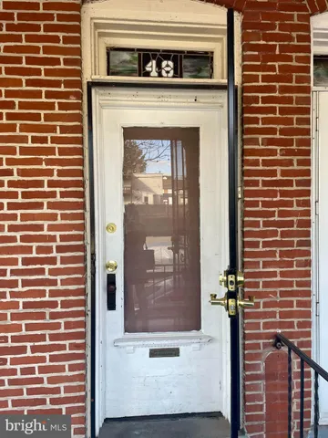 a view of a door of a brick building