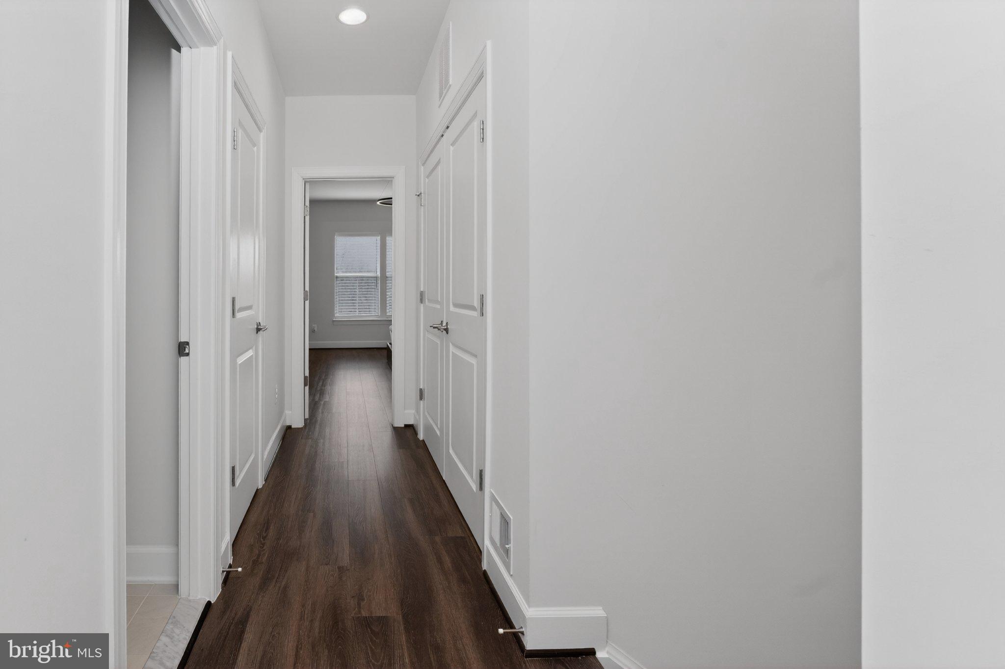 5207 Ridgeview Retreat Drive Chantilly, VA 20151 - Photo 13 of 25 a view of a hallway with a wooden floor