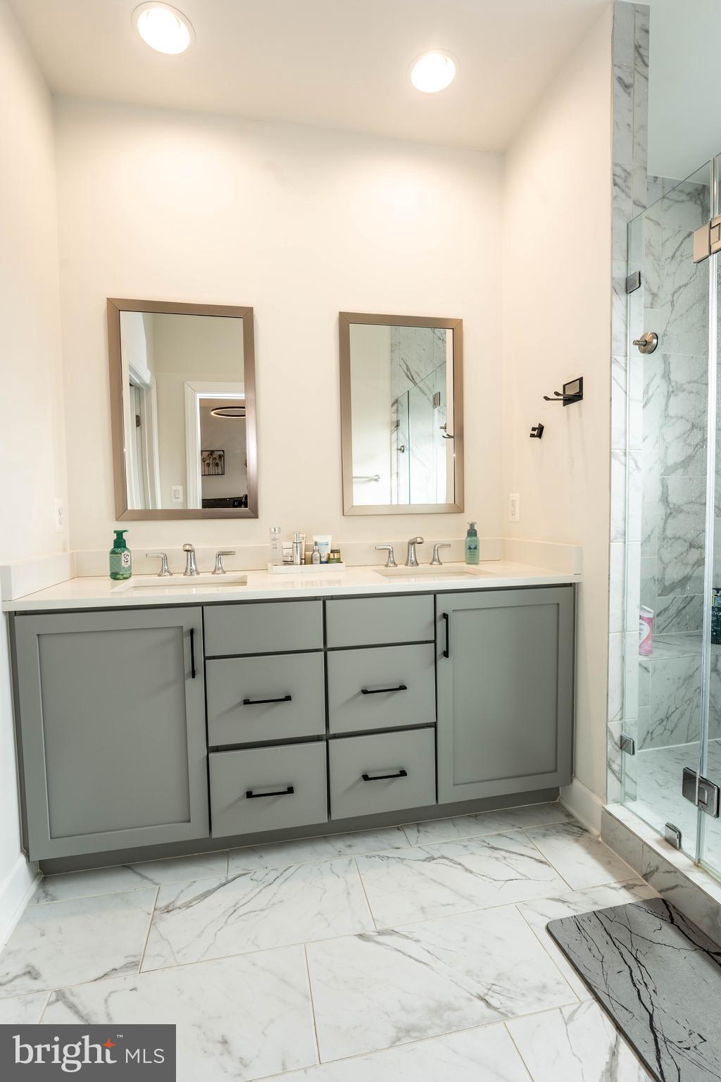 5207 Ridgeview Retreat Drive Chantilly, VA 20151 - Photo 14 of 28 a bathroom with a double vanity sink mirror and