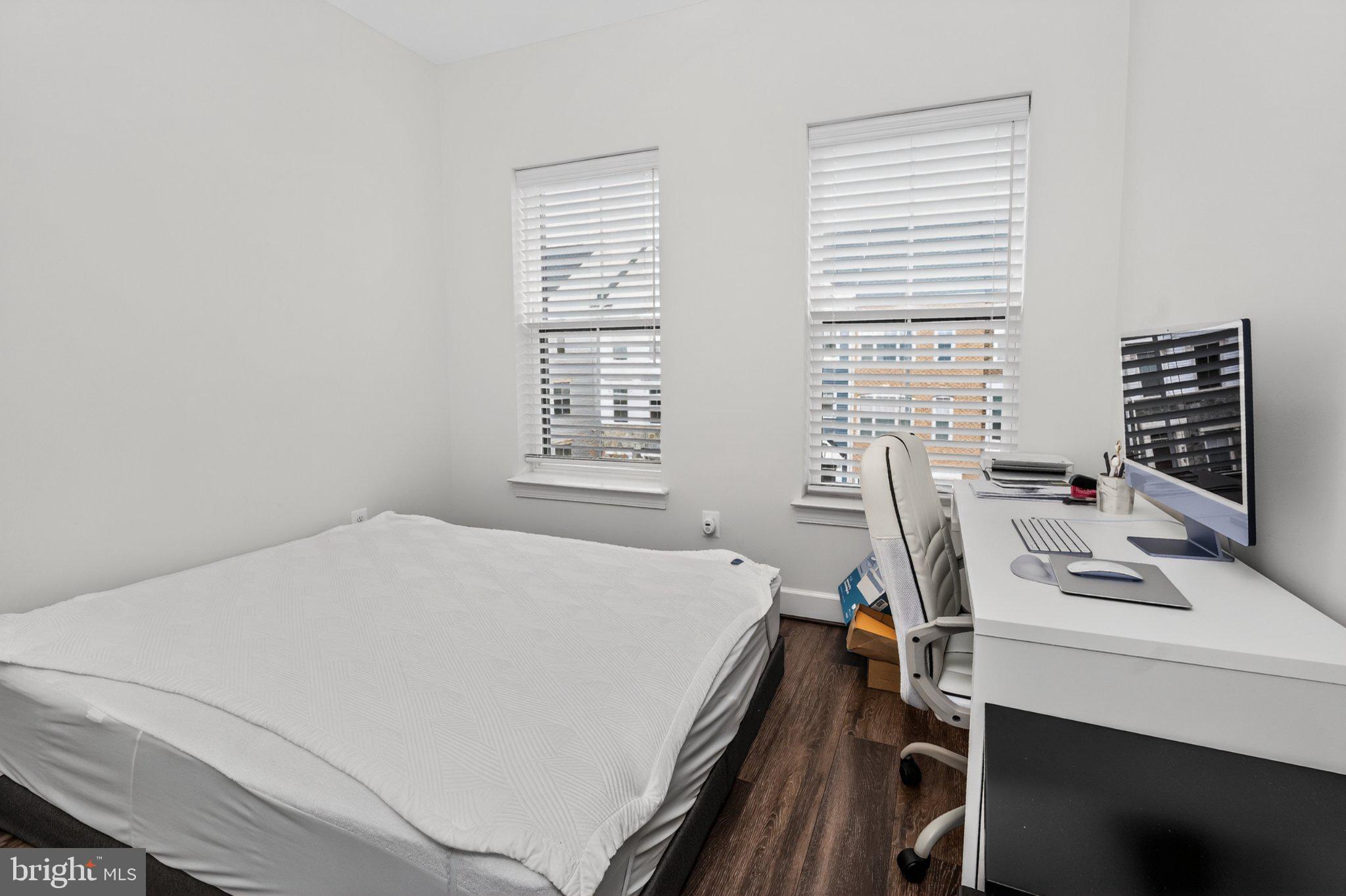 5207 Ridgeview Retreat Drive Chantilly, VA 20151 - Photo 14 of 25 a bed sitting in a bedroom next to a window