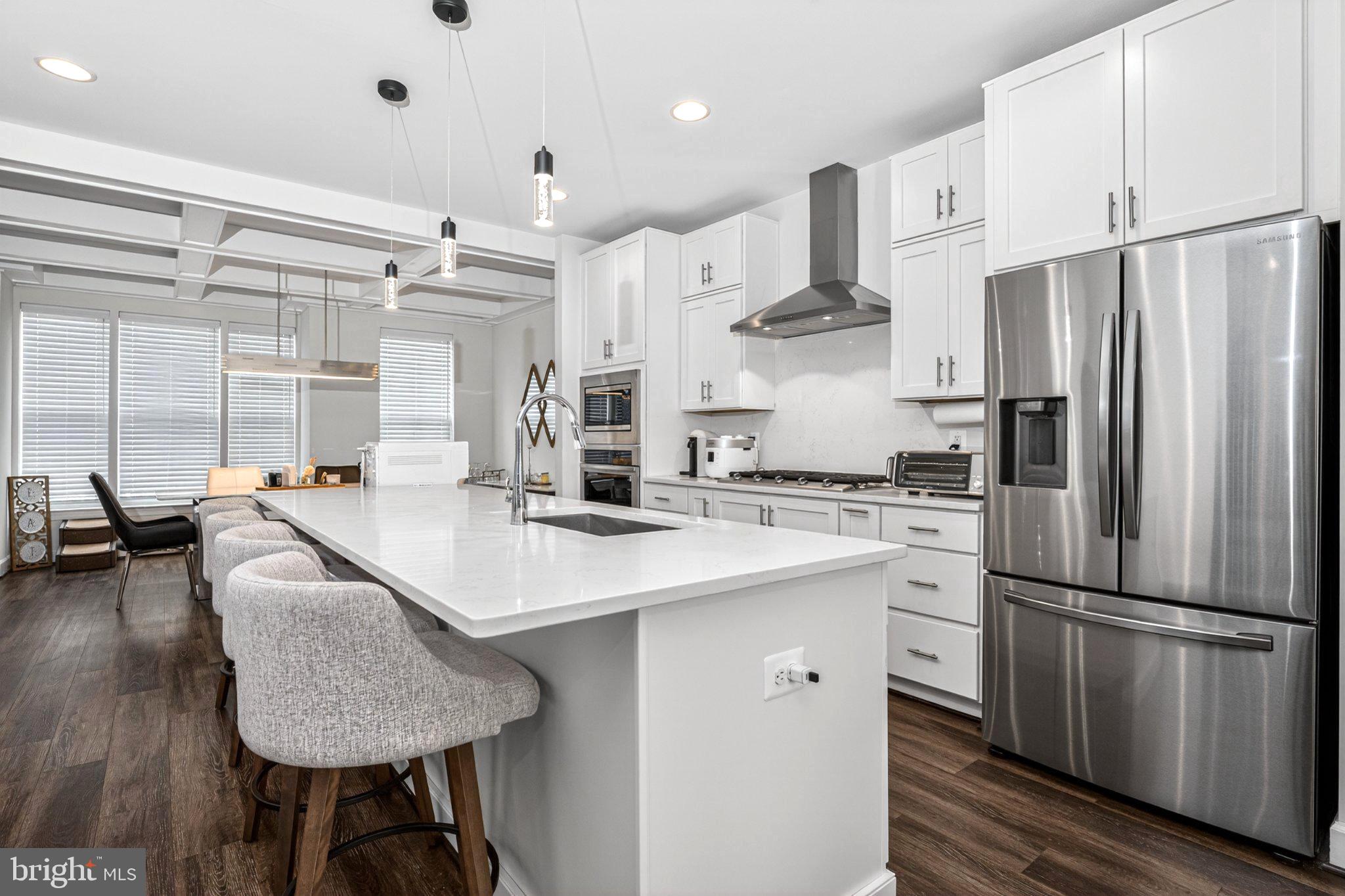 5207 Ridgeview Retreat Drive Chantilly, VA 20151 - Photo 2 of 54 a kitchen with stainless steel appliances granite countertop a sink a stove and a refrigerator