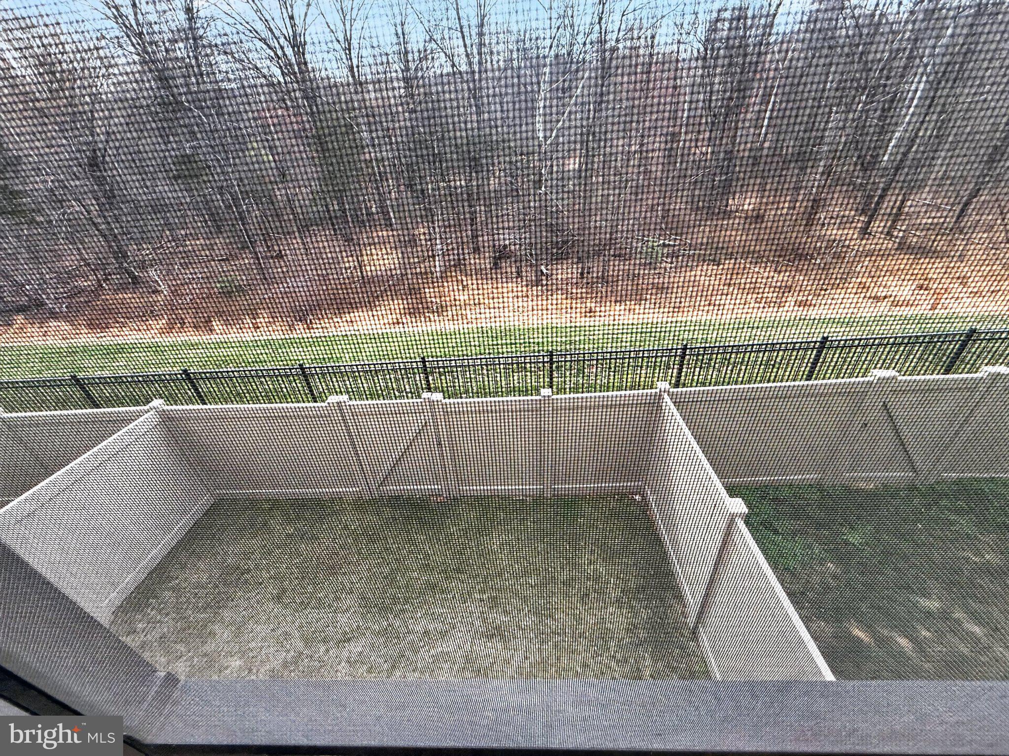 5207 Ridgeview Retreat Drive Chantilly, VA 20151 - Photo 21 of 54 Serene fenced yard with nature backdrop.