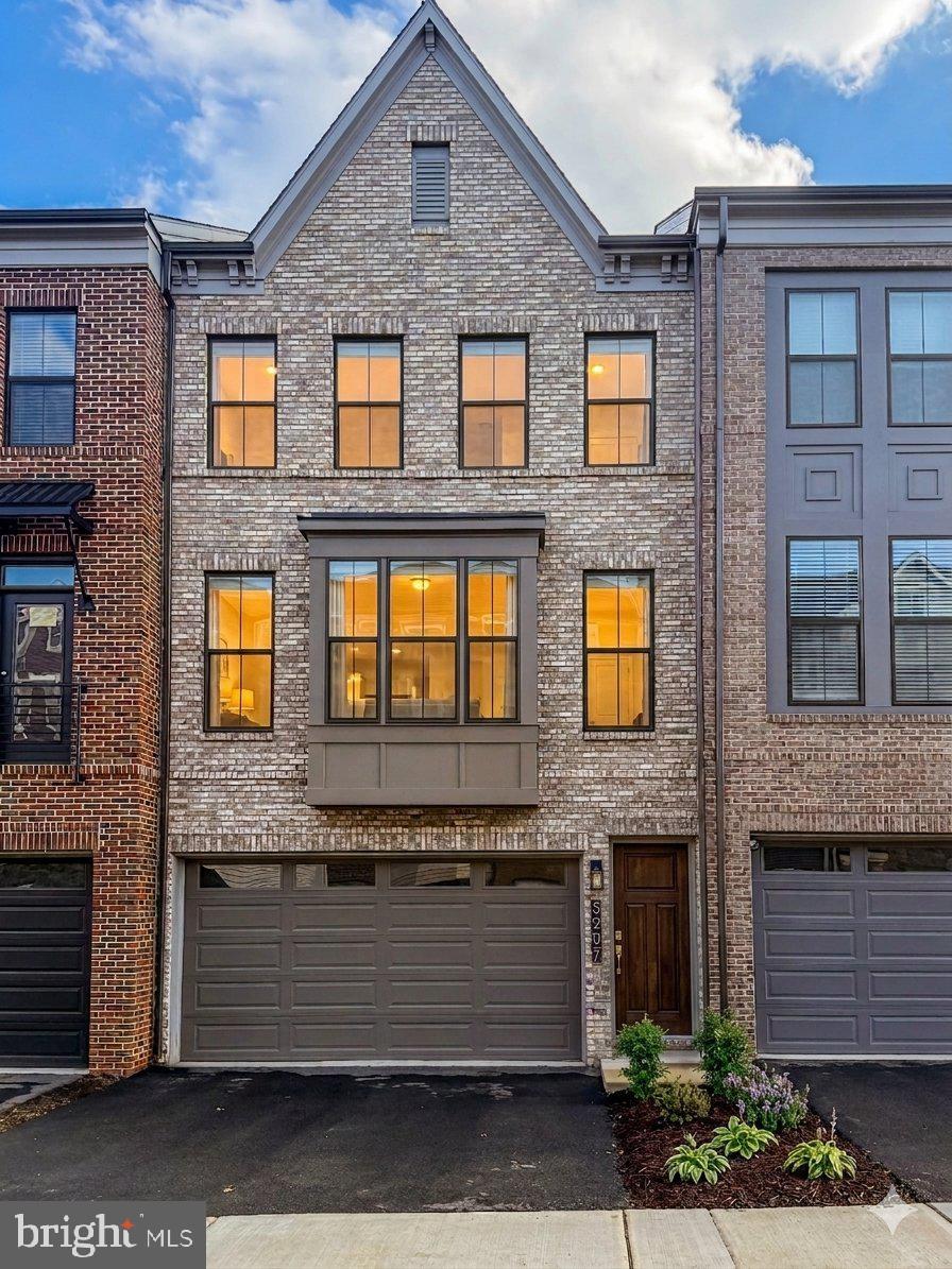 5207 Ridgeview Retreat Drive Chantilly, VA 20151 - Photo 3 of 54 a front view of a brick house with many windows