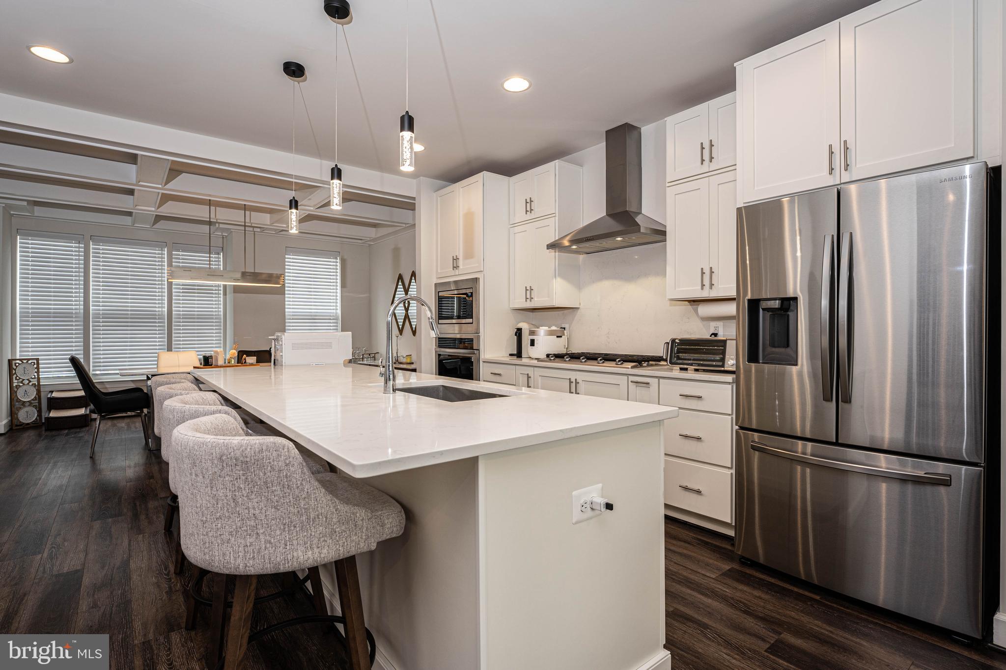 5207 Ridgeview Retreat Drive Chantilly, VA 20151 - Photo 35 of 54 a kitchen with stainless steel appliances refrigerator stove microwave and furniture