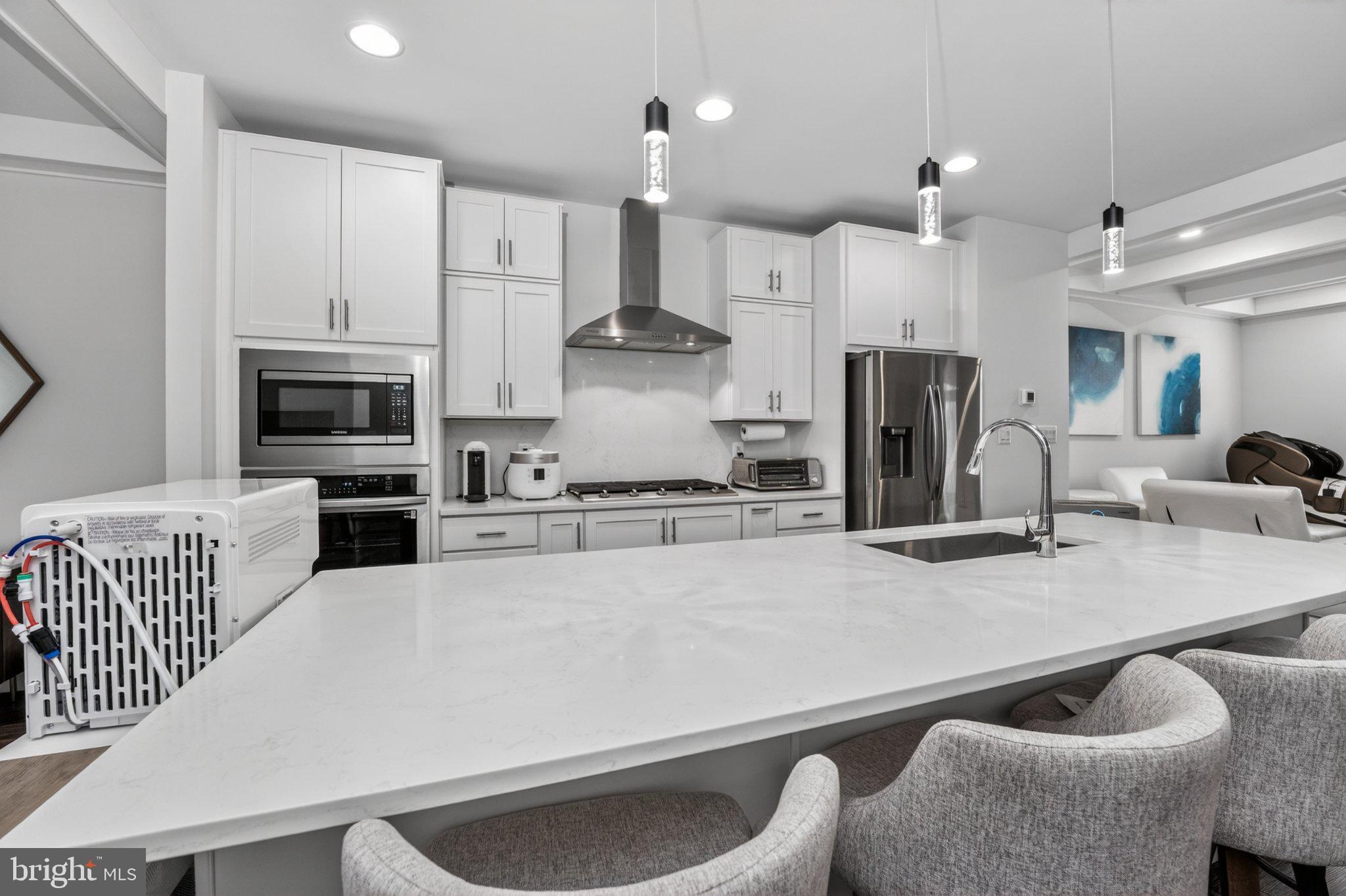 5207 Ridgeview Retreat Drive Chantilly, VA 20151 - Photo 4 of 54 a kitchen with stainless steel appliances granite countertop a sink a stove and a refrigerator