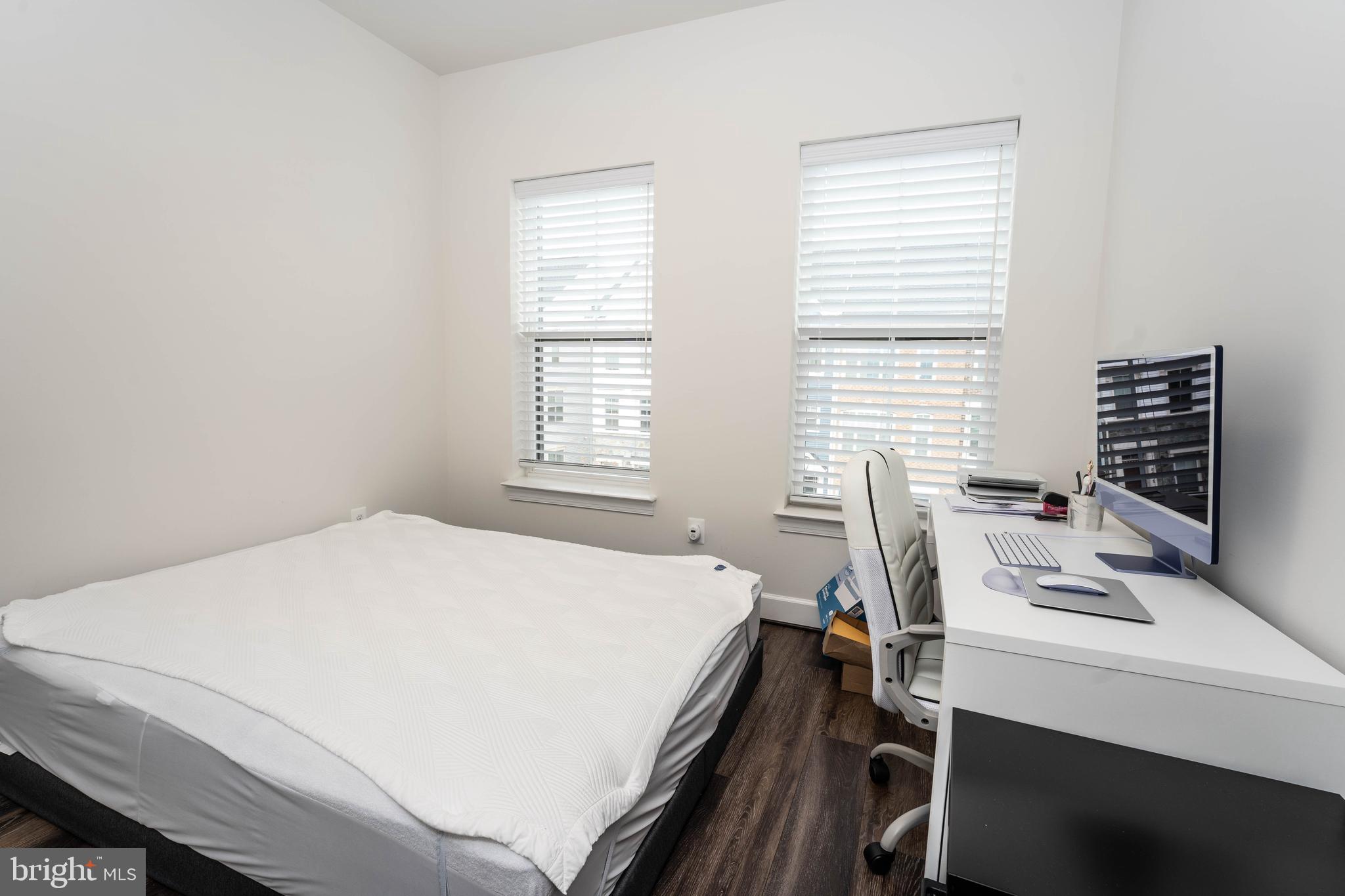 5207 Ridgeview Retreat Drive Chantilly, VA 20151 - Photo 44 of 54 a bedroom with a bed and a table