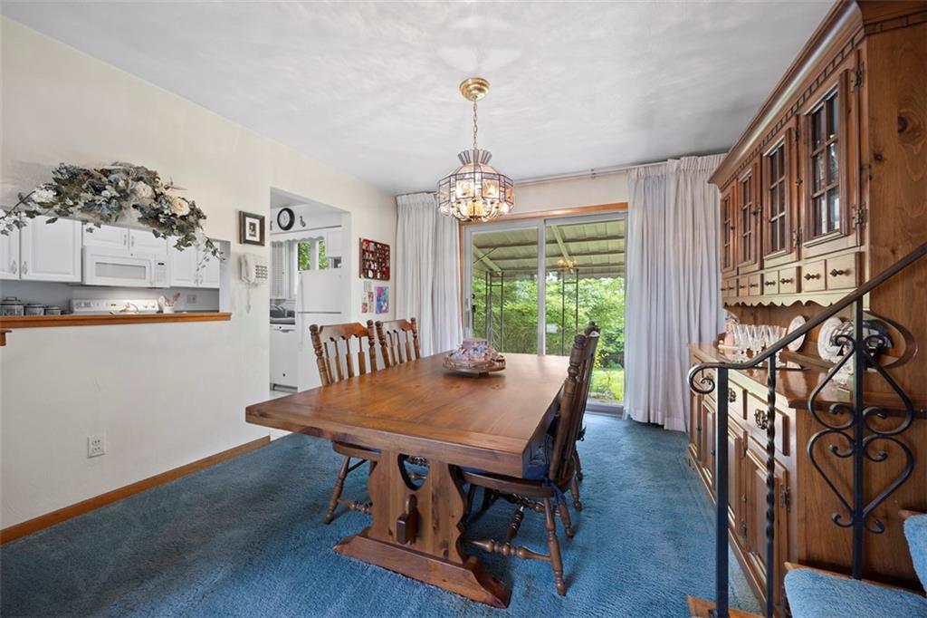 6858 Ridgevue Drive Pittsburgh, PA 15236 - Photo 9 of 29 Semi open to the kitchen this dining room seats six comfortably or could expand into the living area for Thanksgiving seating for many more!