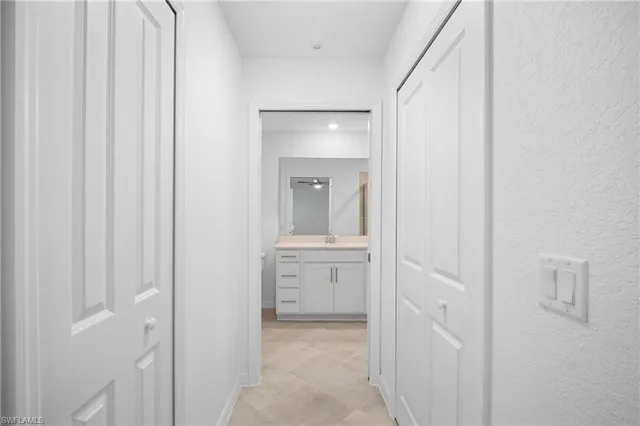 a view of a bathroom from the hallway