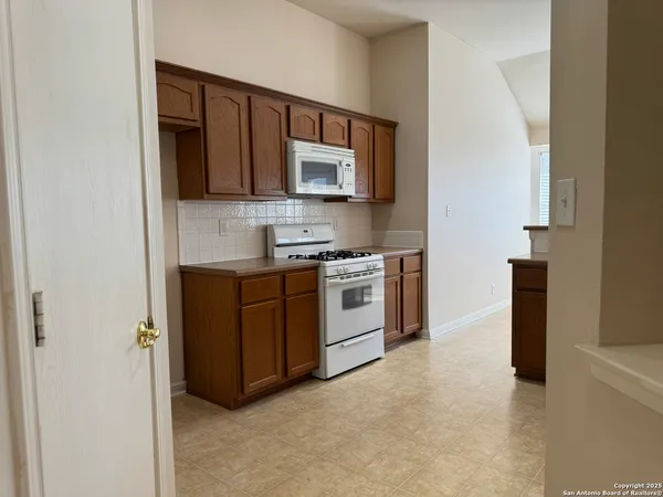 a kitchen with a stove and a microwave
