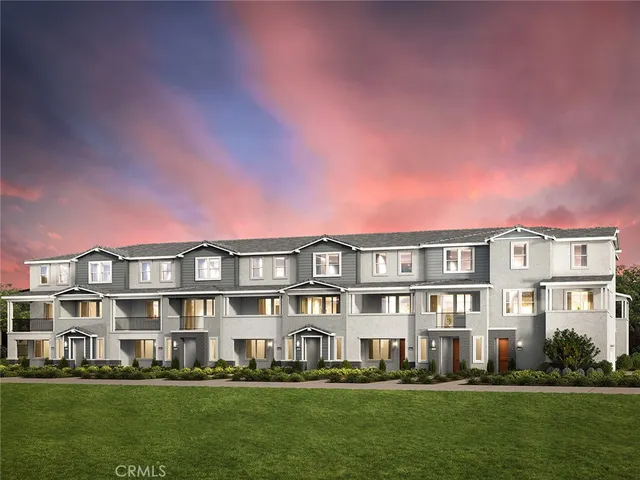 a front view of a building with a yard