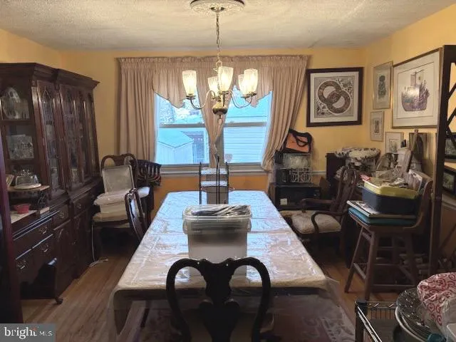 a view of a chairs and a table in the patio