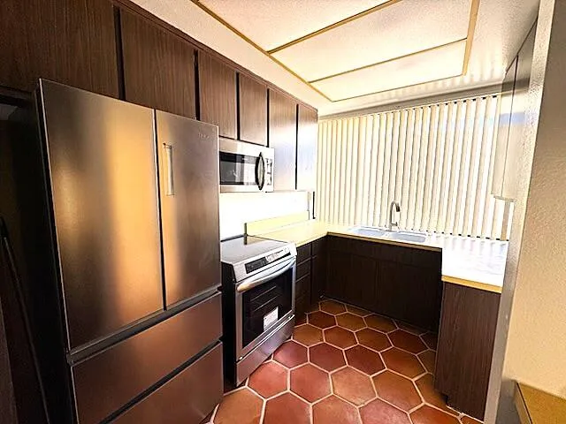 a bathroom with a toilet a sink and a shower