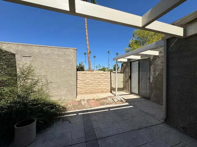 a view of backyard with tub