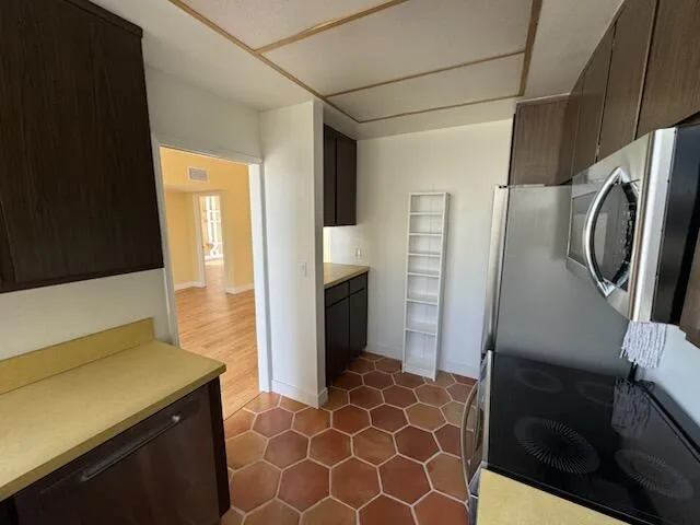 a kitchen with stainless steel appliances a refrigerator and a sink