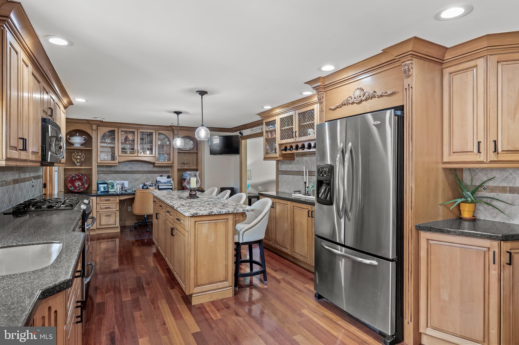 4 Sequoia Drive Cinnaminson, NJ 08077 - Photo 7 of 37 a kitchen with stainless steel appliances granite countertop a refrigerator a stove a sink dishwasher a refrigerator and white cabinets with wooden floor