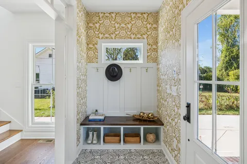 a view of a house with a window and wooden floor