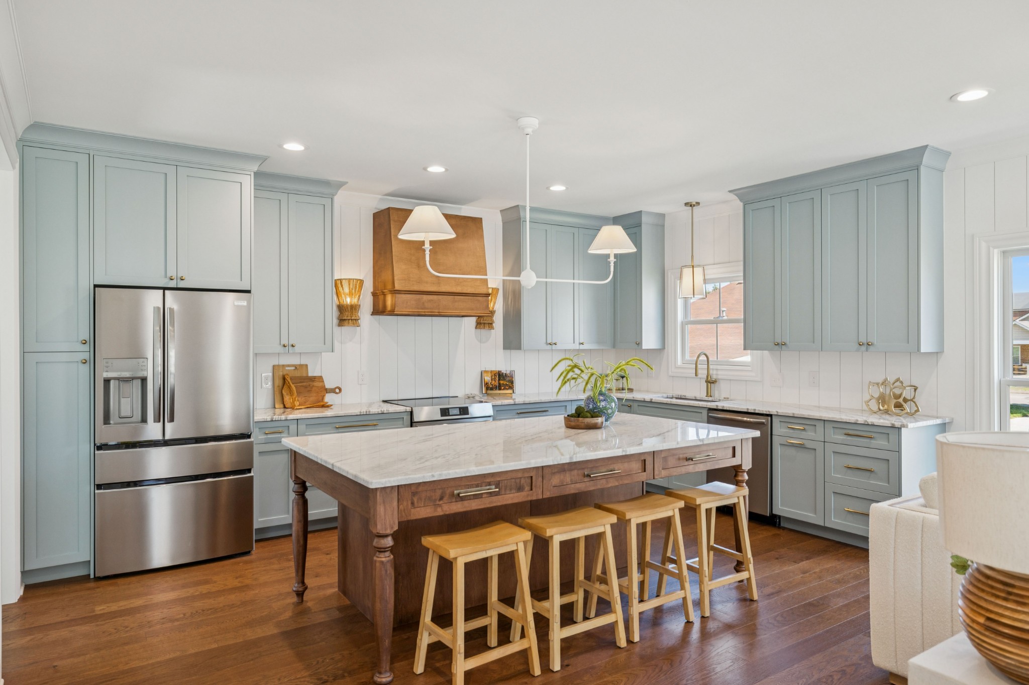 308 Bridge Avenue Murfreesboro, TN 37129 - Photo 4 of 28 a kitchen with stainless steel appliances granite countertop a sink a stove a refrigerator and island with wooden floor