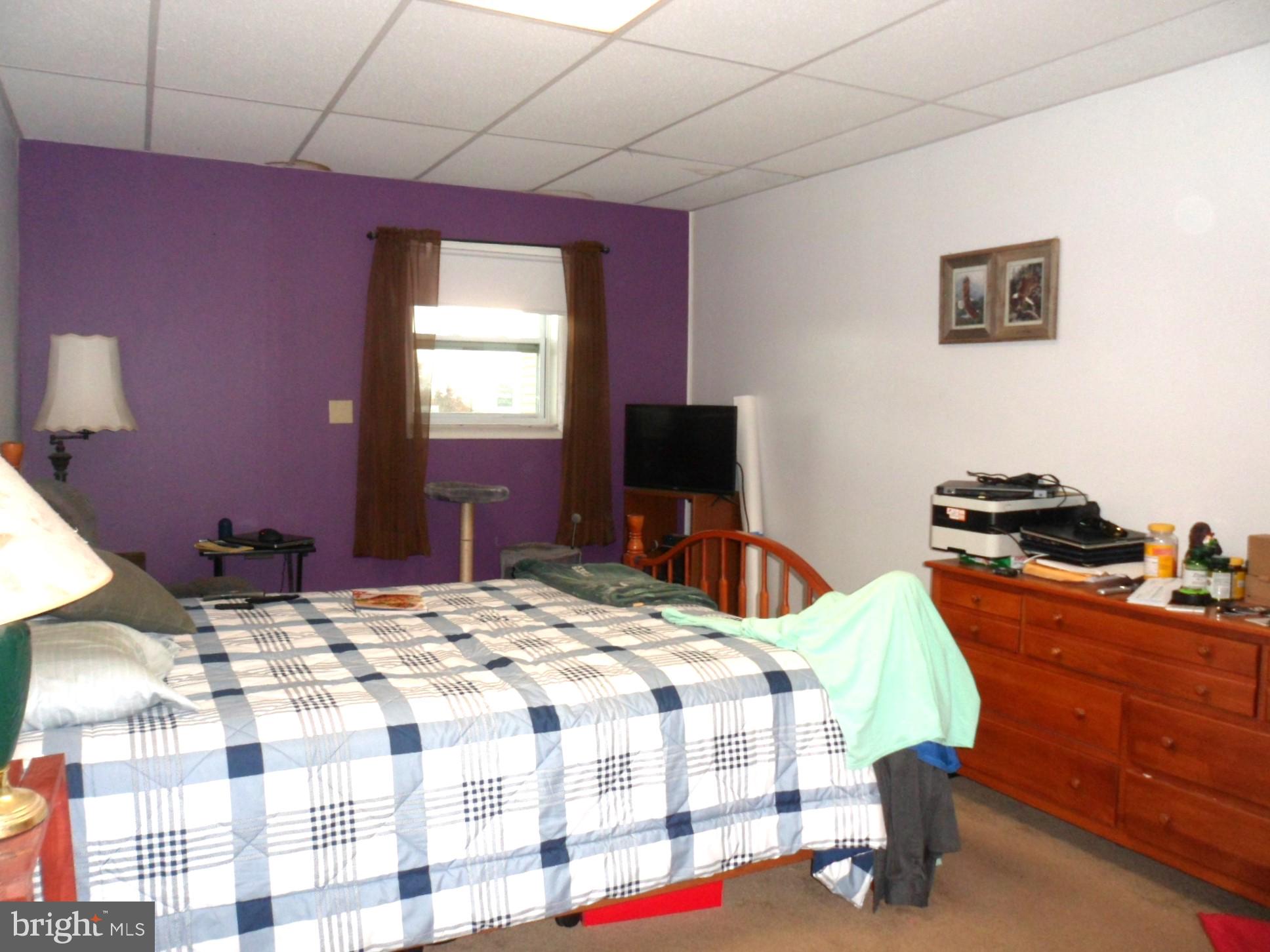 7548 Linglestown Road Harrisburg, PA 17112 - Photo 26 of 38 a bedroom with a bed and a flat screen tv