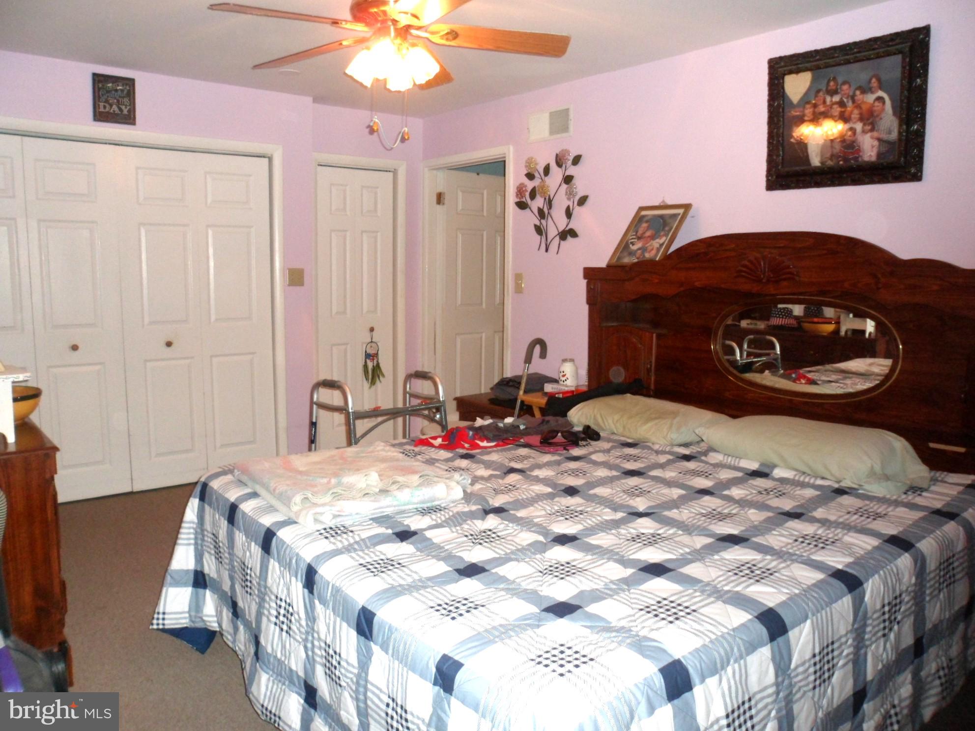 7548 Linglestown Road Harrisburg, PA 17112 - Photo 32 of 38 a bedroom with a bed and a chandelier