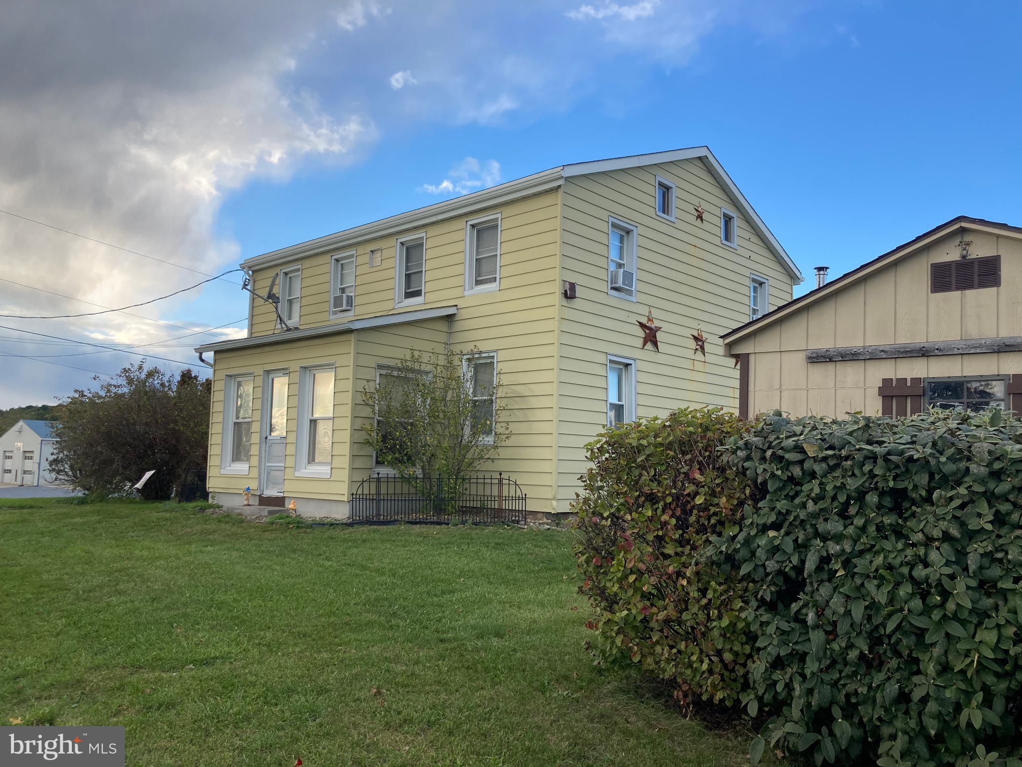 7548 Linglestown Road Harrisburg, PA 17112 - Photo 5 of 38 a front view of a house with a yard and garage