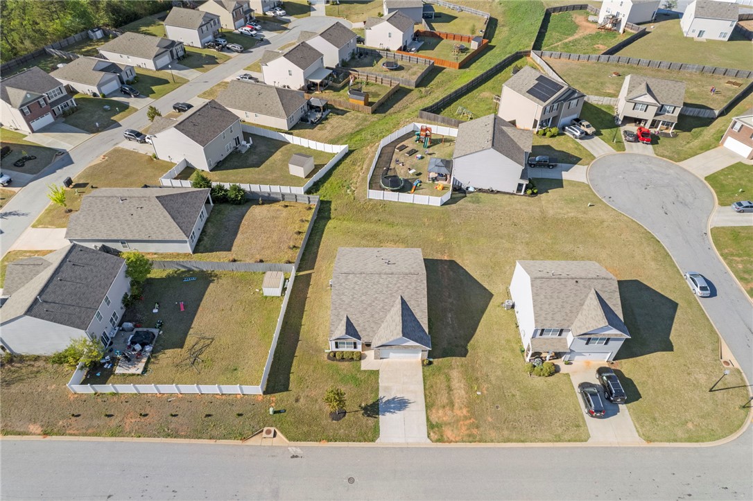 205 Hillendale Way Pelzer, SC 29669 - Photo 28 of 29 An aerial view showcases a residential neighborhood with homes and cul-de-sacs, offering a sense of community.