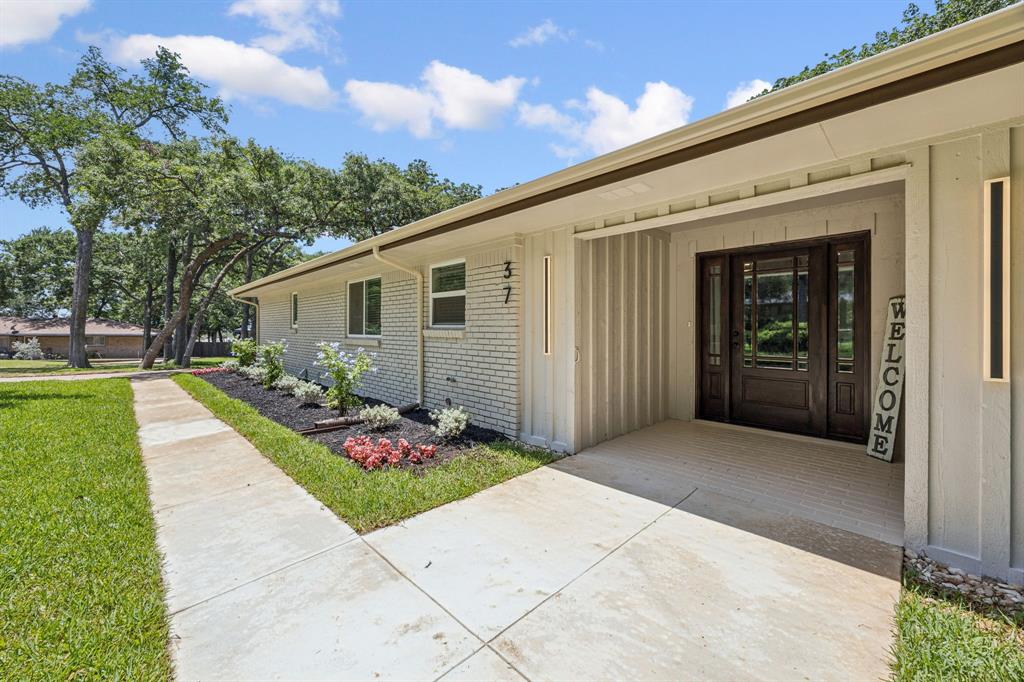 37 Devonshire Bedford, TX 76021 - Photo 1 of 39 a front view of house with yard