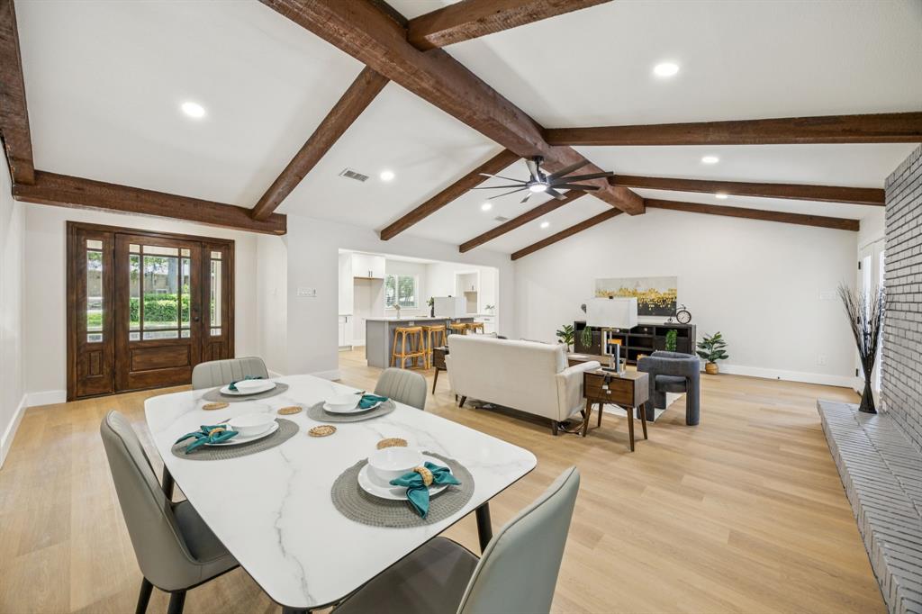 37 Devonshire Bedford, TX 76021 - Photo 10 of 39 a dining room with wooden floor a chandelier a wooden table and chairs