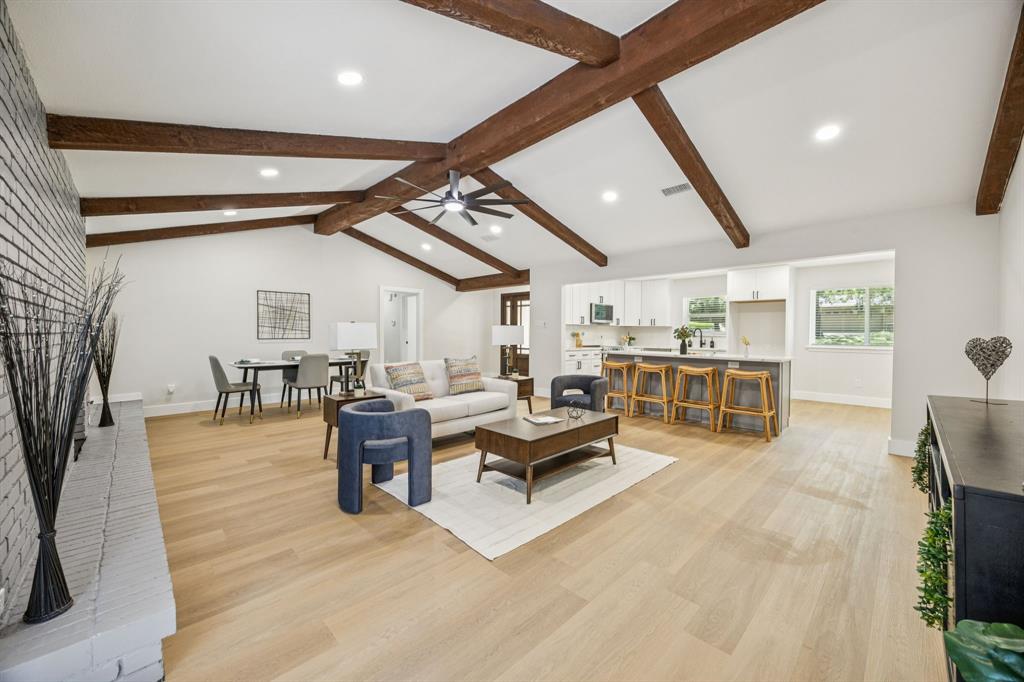 37 Devonshire Bedford, TX 76021 - Photo 11 of 39 a living room with lots of furniture and view of kitchen