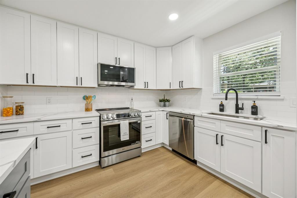 37 Devonshire Bedford, TX 76021 - Photo 16 of 39 a kitchen with white cabinets and white appliances