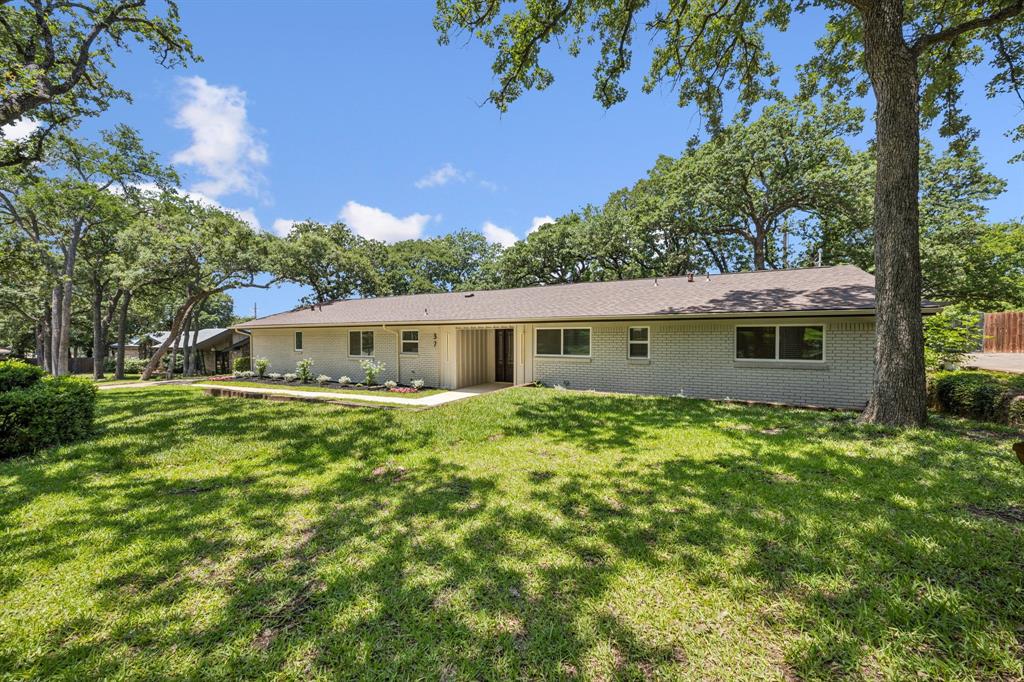 37 Devonshire Bedford, TX 76021 - Photo 2 of 39 a front view of a house with garden