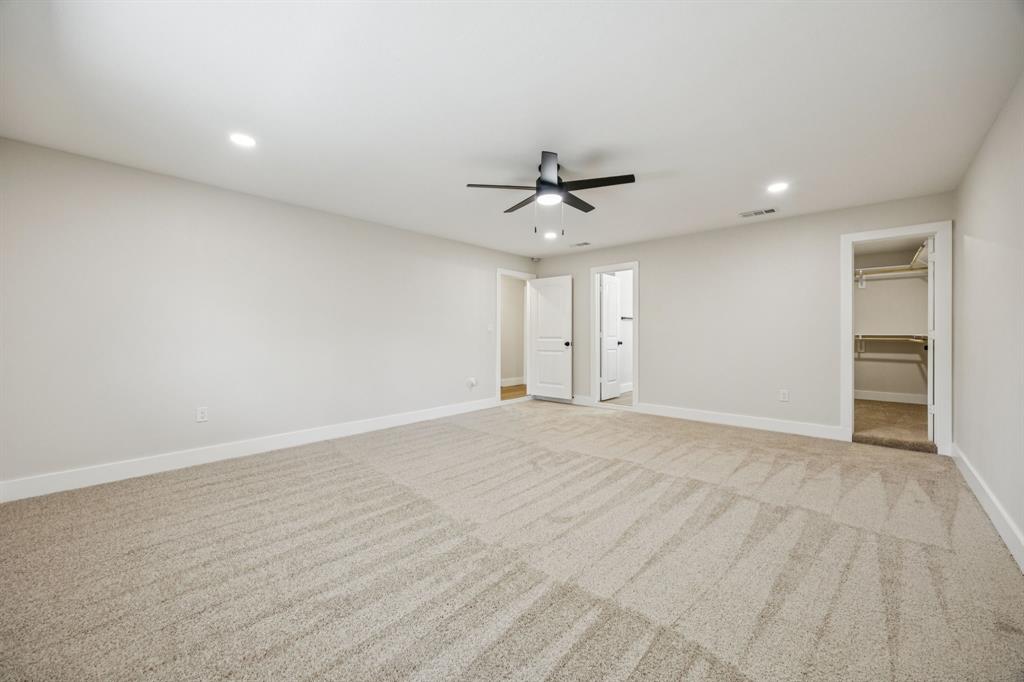 37 Devonshire Bedford, TX 76021 - Photo 22 of 39 a view of an empty room with a ceiling fan