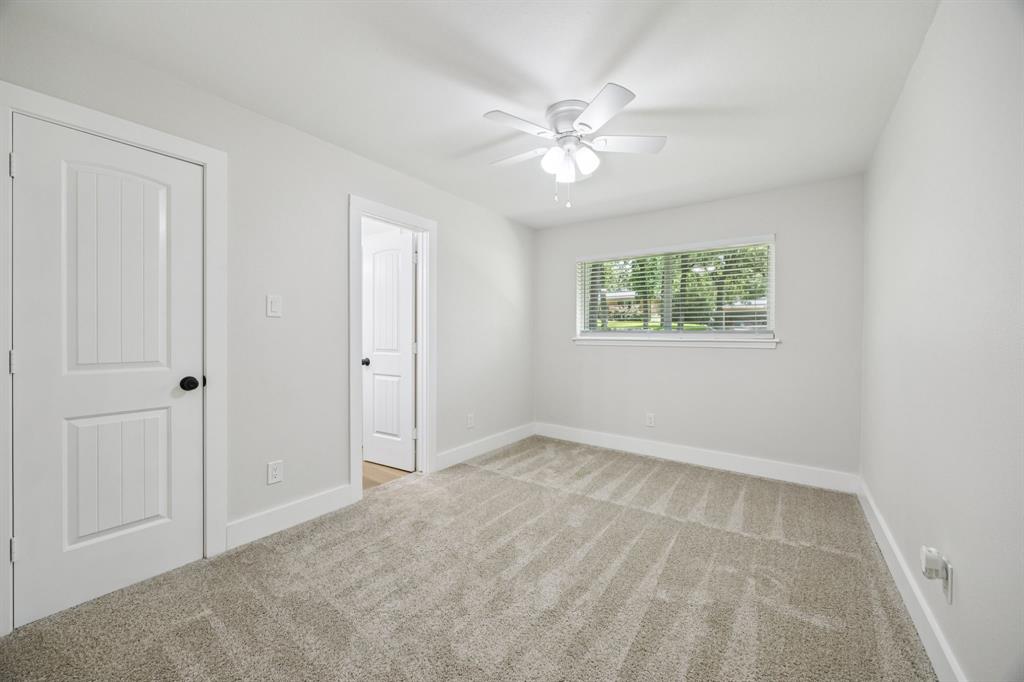37 Devonshire Bedford, TX 76021 - Photo 26 of 39 an empty room with windows and fan