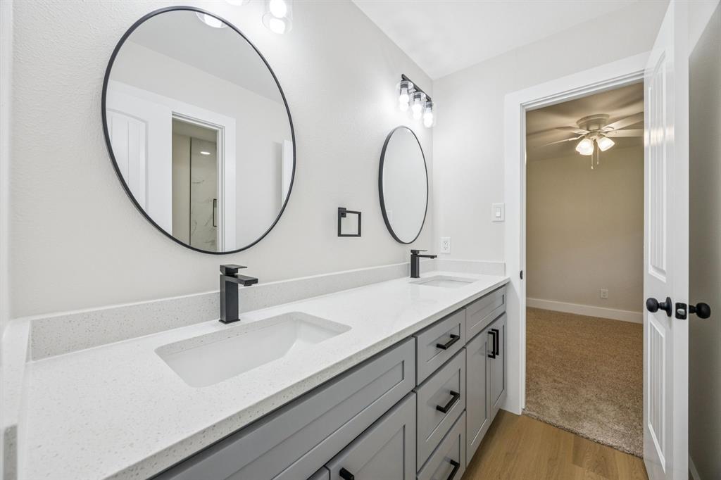 37 Devonshire Bedford, TX 76021 - Photo 27 of 39 a bathroom with a sink and a mirror