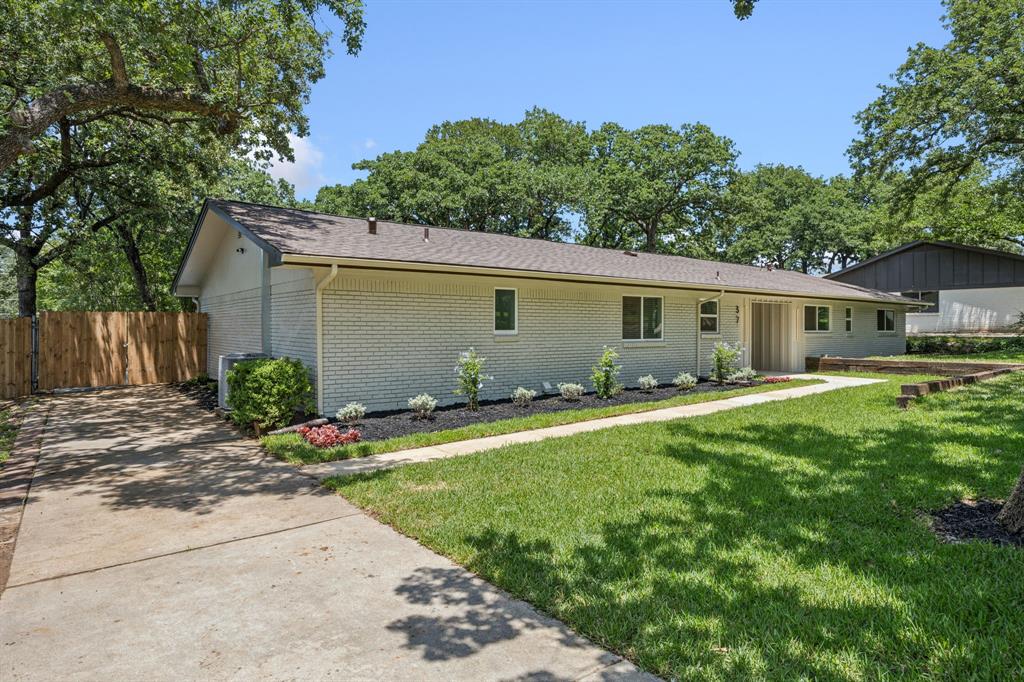 37 Devonshire Bedford, TX 76021 - Photo 3 of 39 a front view of house with yard and green space