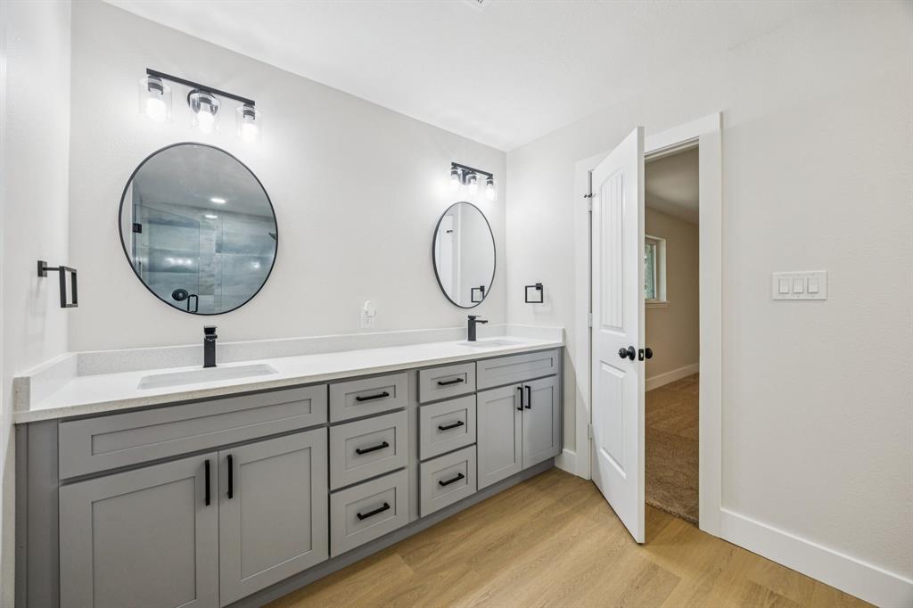 37 Devonshire Bedford, TX 76021 - Photo 33 of 39 a bathroom with a double vanity sink and a mirror