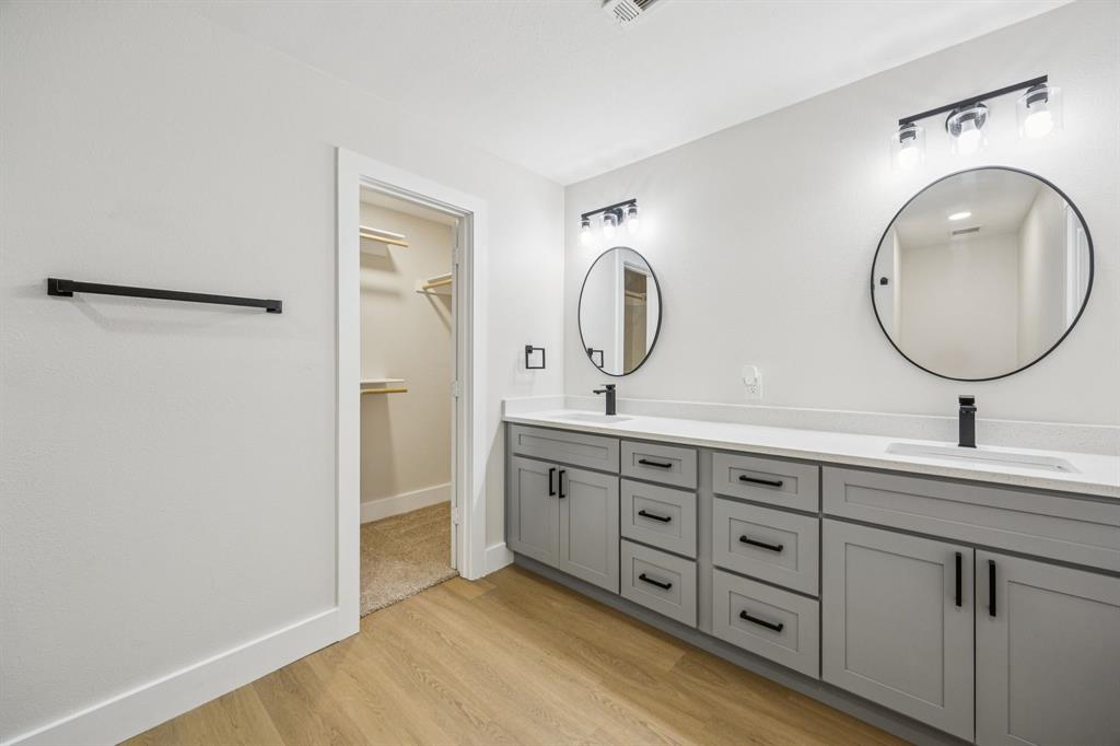 37 Devonshire Bedford, TX 76021 - Photo 34 of 39 a spacious bathroom with a double vanity sink and a mirror
