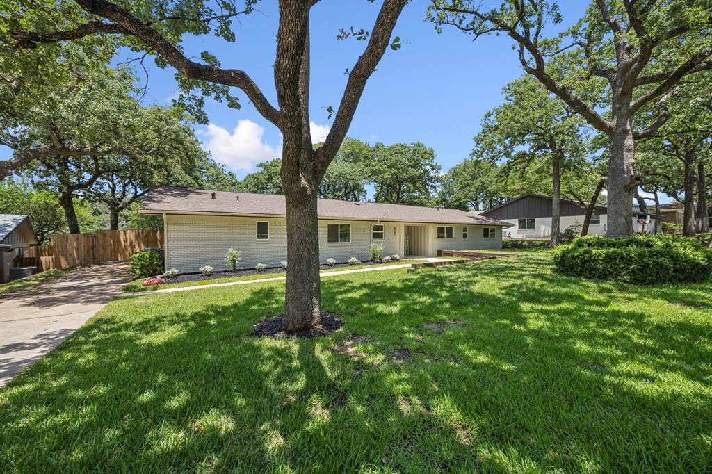37 Devonshire Bedford, TX 76021 - Photo 4 of 39 a view of a house with backyard and a tree