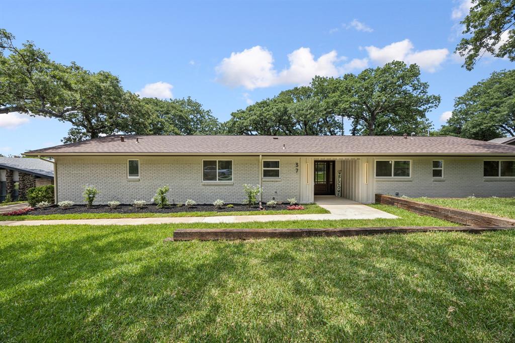 37 Devonshire Bedford, TX 76021 - Photo 6 of 39 a front view of house with yard and green space