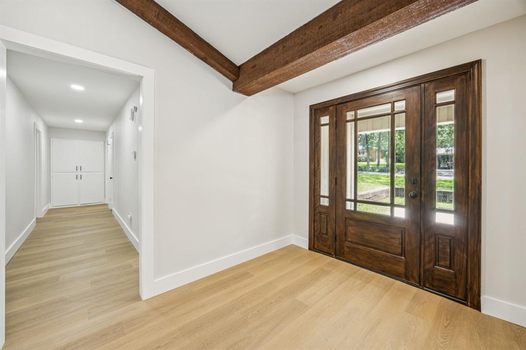 37 Devonshire Bedford, TX 76021 - Photo 8 of 39 a view of entryway with wooden floor