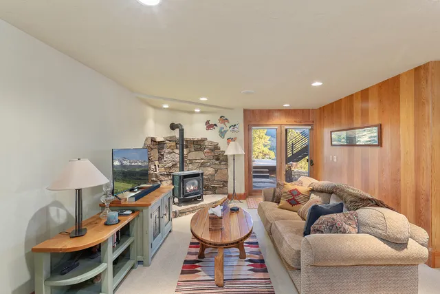 a living room with furniture and a rug