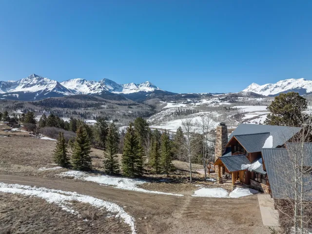 a view of a dry yard covered with snow