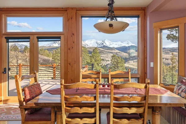a view of a dining room with furniture window and outside view