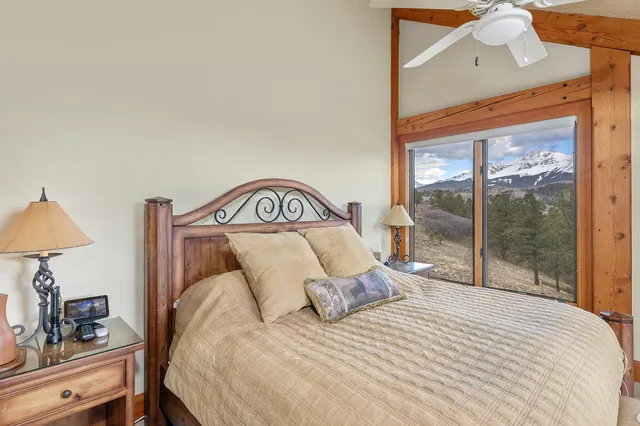 a bedroom with a large bed and a window