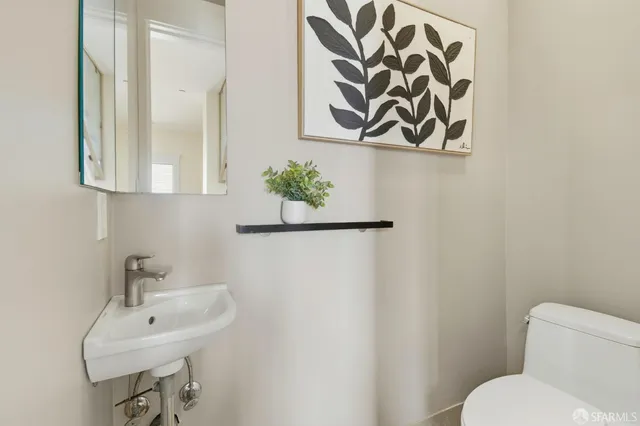 a bathroom with a sink a toilet and bathtub