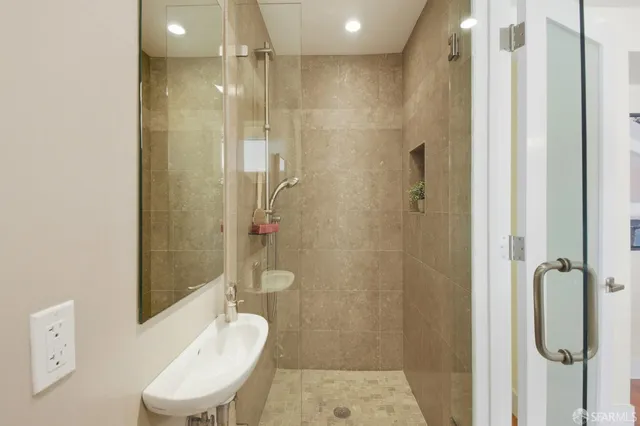 a view of a hallway with washer and dryer