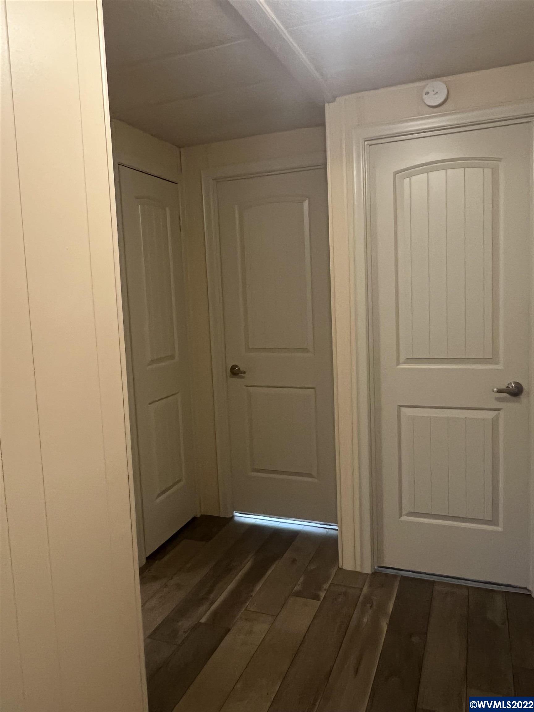 151 Edwards Road South, Unit 68 Monmouth, OR 97361 - Photo 7 of 36 a view of a hallway with wooden floor
