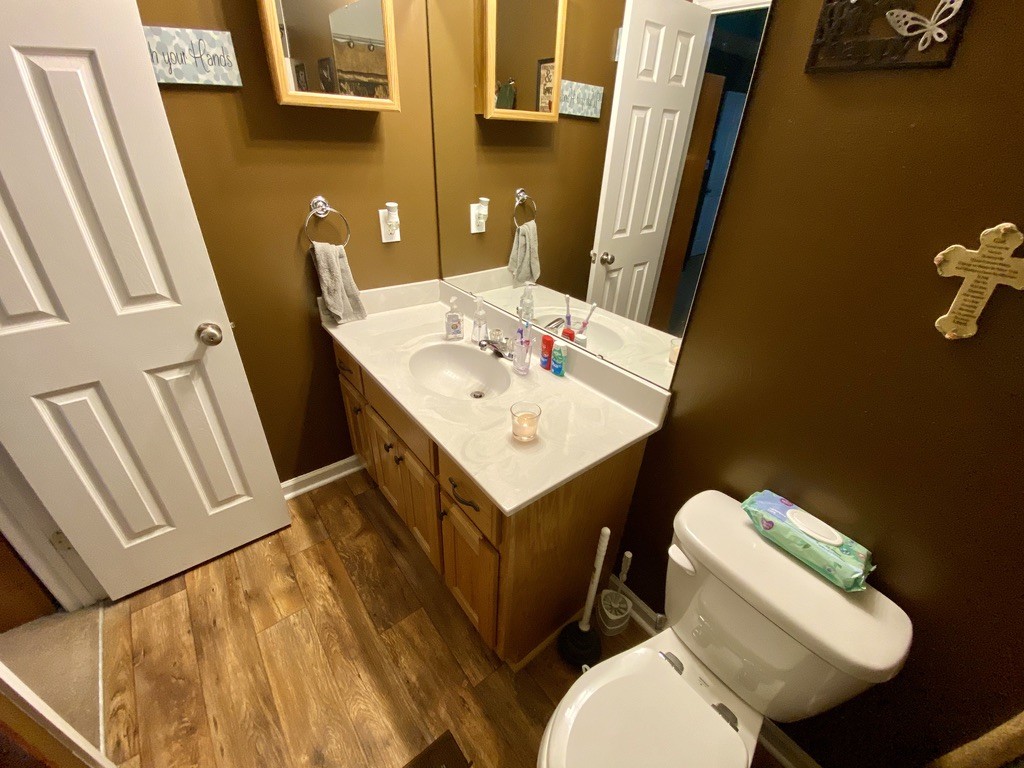151 Wells Lee Road Elora, TN 37328 - Photo 14 of 30 a bathroom with a sink toilet and mirror
